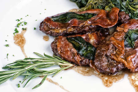 restaurant dish consisting of roasted meat with vegetablesの写真素材