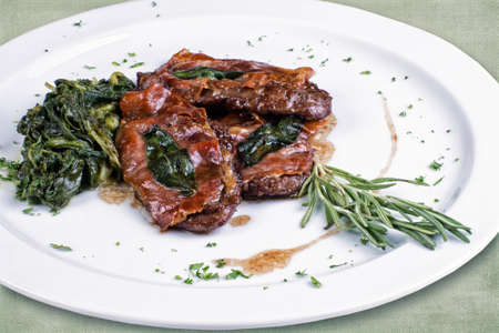 restaurant dish consisting of roasted meat with vegetablesの写真素材