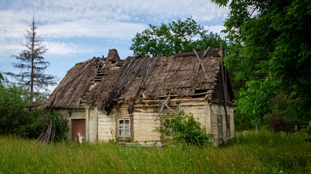 Old abandoned ruined wooden house in the countrysideの写真素材