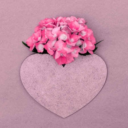 Pink hydrangea with heart and copy space for design.