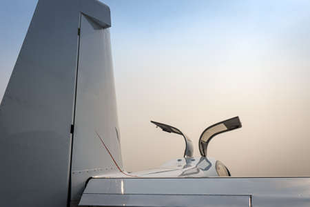 Small private white plane before the flight. Front view. Close-up.