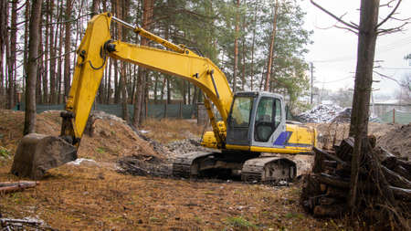 Excavator working on a construction site in the countrysideの写真素材