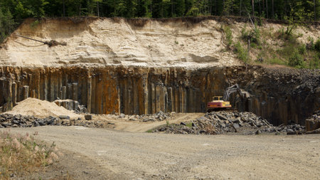 Abandoned basalt quarry. Basalt faceted rocks.の写真素材