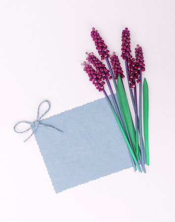 Spring card with a bouquet of bright purple flowersの写真素材