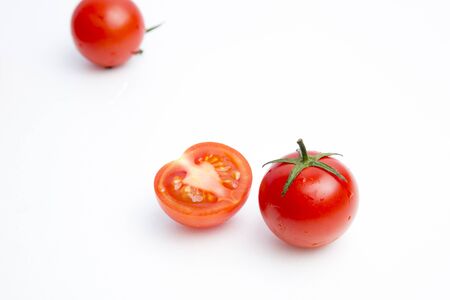 Cherry tomatoes on whiteの写真素材