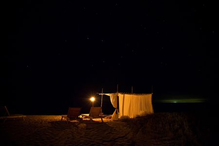 Beach cabana under the stars on an island.の写真素材