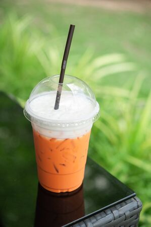 Thai milk tea topping cream cheese in glass plasticの写真素材