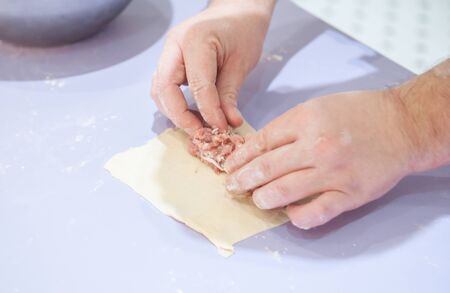Chef using hands preparing food in the kitchenの写真素材