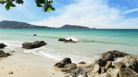 Sea view from soft wave beach with sunny sky. Tropical sea in Phuket Thailand.の写真素材