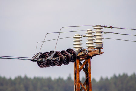 electricity transmission line old rusty transformer mast