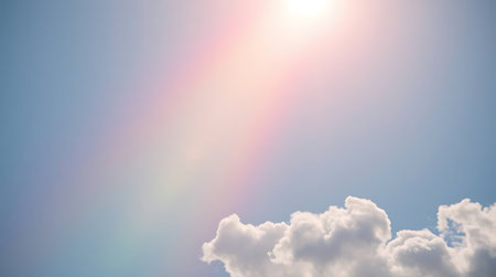 Blue sky background with tiny clouds and sunbeams. Nature background.の素材