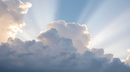 Blue sky with white clouds and sunbeams nature background.の素材