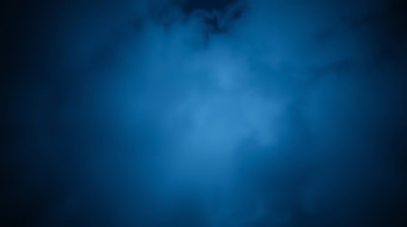 Dark background with blue smoke.の素材