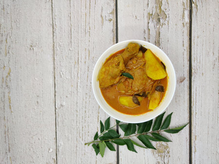 A serving of chicken curry with potatoesの写真素材