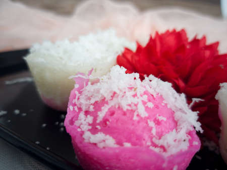 Fluffy and delicious steamed rice cake with grated coconut on top. Selective focus points. Blurred backgroundの写真素材