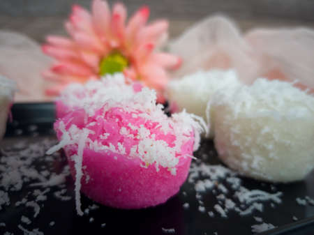Fluffy and delicious steamed rice cake with grated coconut on top. Selective focus points. Blurred backgroundの写真素材
