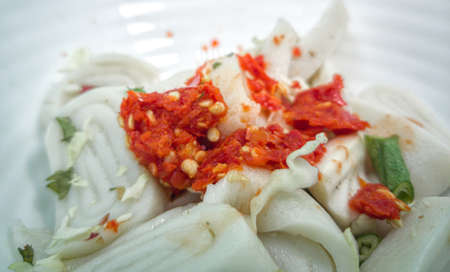 Laksam, flat rice noodle with vegetables in coconut fish gravy. Popular traditional food in East Coast Malaysiaの写真素材