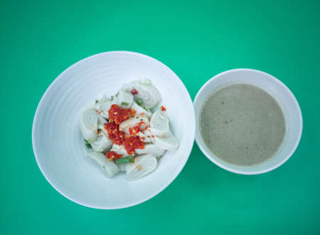 Laksam, flat rice noodle with vegetables in coconut fish gravy. Popular traditional food in East...