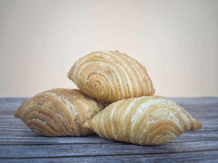 The spiral curry puff or locally known as karipap pusing. Popular dessert in Malaysia. Selective...