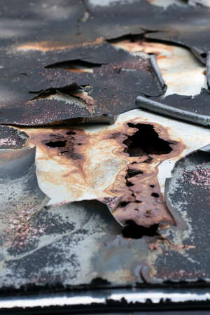 Close-up of peeled body paint from top of an old car. Selective focus points. Blurred backgroundの写真素材