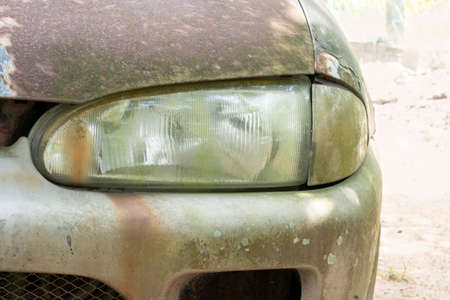 Close-up of an old car headlamp. Selective focus points. Blurred backgroundの写真素材