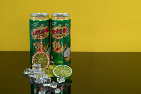 Selangor, Malaysia: June 16, 2021 - Two cans of citrus flavoured carbonated drink the classic brand Kickapoo. Selective focus points. Blurred backgroundのeditorial素材