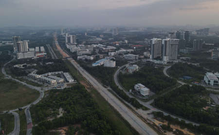 Cyberjaya, Malaysia: Feb 16, 2021 - Overhead view of office buildings area in morning light.