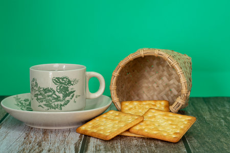 Breakfast serving of cream crackers and a cup of tea. Selective focus points. Blurred backgroundの写真素材