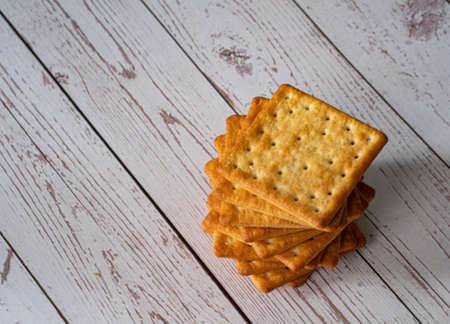 A stack of cream crackers for breakfast. Selective focus points. Blurred backgroundの写真素材