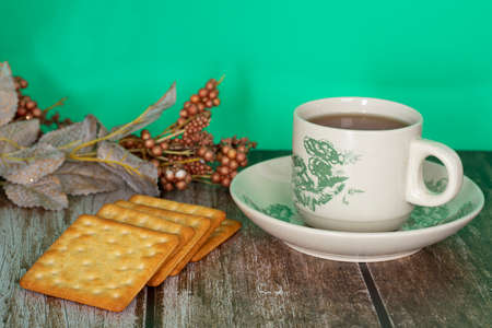 Breakfast serving of cream crackers and a cup of tea. Selective focus points. Blurred backgroundの写真素材