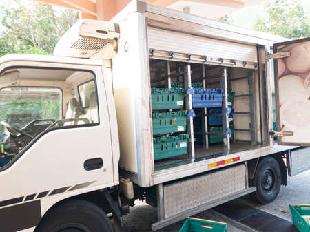 A local delivery van delivering customer's orders. Most customers opt to buy online during the pandemic. Selective focus points. Blurred backgroundの写真素材