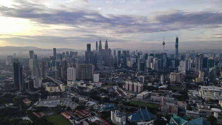Aerial view of Kuala Lumpur, Malaysia under early morning sun with slight haze. Image may contain grains due to low lightsのeditorial素材