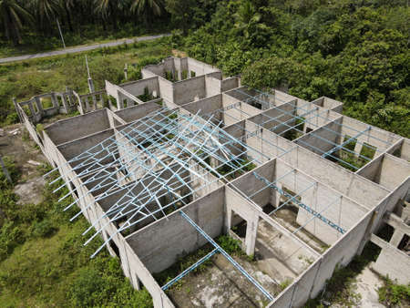 Aerial view of an abandoned house during construction. Selective focus points. Blurred background