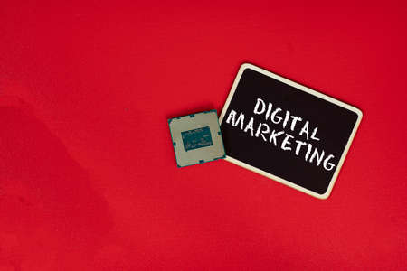 Small blackboard, a computer chip and text Digital Marketing. Business conceptの写真素材