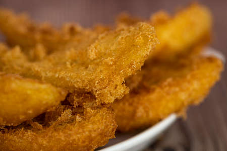 Close-up of freshly cooked fried bananas. Selective focus points. Blurred background.の写真素材