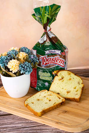 Selangor, Malaysia: Sept 8, 2021 - Two slices of the brand new Gardenia's Pandan Coconut bread. Blurred backgroundのeditorial素材