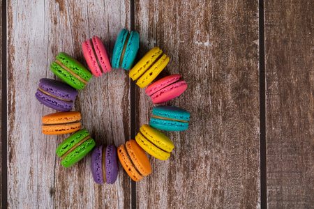 Delicious macaroons, a famous multicoloured French dessert in a circle. Selective focus. Blurred backgroundの写真素材