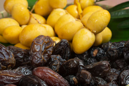 Bunch of different types of dates mixed together. Selective focus points. Blurred background