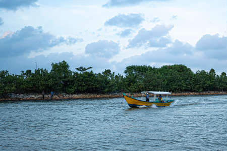 Terengganu, Malaysia: Jan 17, 2022 - Small speedboat moving along the river in the east coast state of Malaysia.のeditorial素材