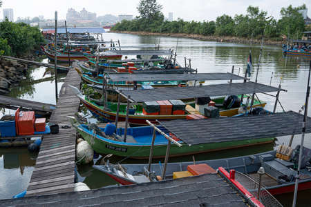 Terengganu, Malaysia: Jan 16, 2022 - a few fishing boats moored on the bank of the river in the Malaysian East Coastのeditorial素材