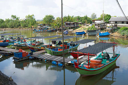 Terengganu, Malaysia: Jan 16, 2022 - a few fishing boats moored on the bank of the river in the Malaysian East Coastのeditorial素材