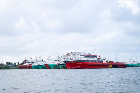 Terengganu, Malaysia: Jan 16, 2022 - offshore tug supply vessel moored on the bank of the river in...