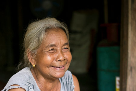 Chini, Malaysia: 19 April 2022 - A close-up of a single indigenous woman smilingのeditorial素材