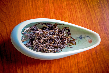 Puer tea in a bowl on wooden backgroundの写真素材