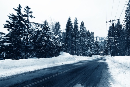 Icy Road Leading to Snow Mountainの写真素材