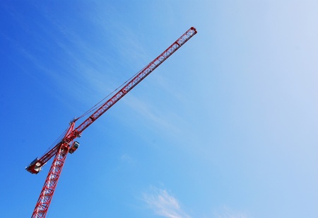 Red Tower Crane with Wispy Cloudsの写真素材
