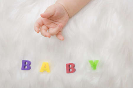 A close up of mother hand holding a baby handの写真素材