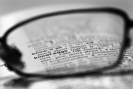 A shot of the word knowledge through a spectacle lens.の写真素材