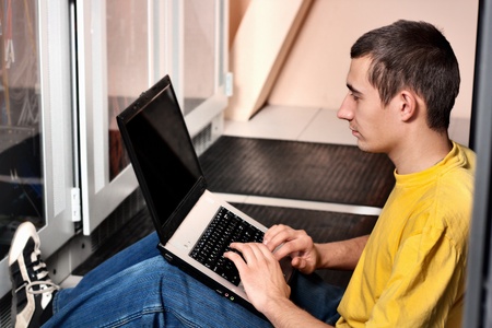 The engineer sits in datacenterの写真素材