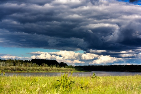 Thunderclouds over the river. Russia. Vetluga.の写真素材